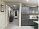 Stylish hallway with modern decor, neutral colors, and easy access to the kitchen at 11562 W Levi Dr, Avondale, AZ 85323