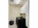 Functional laundry room with modern washer and dryer, plus convenient storage cabinets at 11562 W Levi Dr, Avondale, AZ 85323