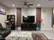 Cozy living room with entertainment center and comfortable seating, perfect for relaxing and entertaining at 11562 W Levi Dr, Avondale, AZ 85323