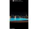 Inviting community pool, brightly lit for evening enjoyment at 11562 W Levi Dr, Avondale, AZ 85323