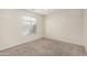 Bright bedroom with carpeted flooring, a ceiling fan and a window that provides ample natural light at 12376 W Hazelwood St, Avondale, AZ 85392