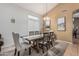 Bright dining room offers a welcoming space for gatherings with ample seating and natural light at 12376 W Hazelwood St, Avondale, AZ 85392
