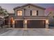 Inviting two-story home featuring a neutral color palette and a spacious two-car garage for convenient parking and storage at 12376 W Hazelwood St, Avondale, AZ 85392