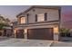 Attractive two-story house showcasing a well-maintained driveway and a roomy two-car garage at 12376 W Hazelwood St, Avondale, AZ 85392
