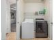 Laundry room area featuring side-by-side washer and dryer units at 12376 W Hazelwood St, Avondale, AZ 85392
