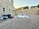 Gravel backyard featuring a sports court and equipment, adjacent to the house at 12950 W Cassia Trl, Peoria, AZ 85383