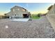Spacious backyard with gravel landscaping, basketball court, and playground at 12950 W Cassia Trl, Peoria, AZ 85383