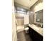 Bathroom featuring a shower-tub combination, stone floors, and a dark vanity with a stone countertop at 12950 W Cassia Trl, Peoria, AZ 85383