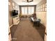 Large flex room featuring carpeted floors, bright windows, and ample space for various activities at 12950 W Cassia Trl, Peoria, AZ 85383
