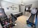Entertaining game room featuring arcade games, air hockey table, and comfortable seating at 12950 W Cassia Trl, Peoria, AZ 85383