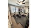 Well-equipped home gym featuring weightlifting equipment, a full mirror, and cushioned flooring at 12950 W Cassia Trl, Peoria, AZ 85383