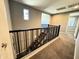 Upstairs landing showcasing the stairway and carpet flooring at 12950 W Cassia Trl, Peoria, AZ 85383