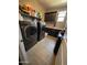 Functional laundry room with modern washer and dryer, cabinets, and countertop space at 12950 W Cassia Trl, Peoria, AZ 85383