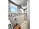 Stylish shower with tiled walls, mosaic accents, and natural light from the window at 12950 W Cassia Trl, Peoria, AZ 85383