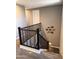 Carpeted stairway showcasing the decorative wall art and stairway lights at 12950 W Cassia Trl, Peoria, AZ 85383