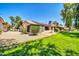 Spacious backyard with a well-manicured lawn at 14151 W Yosemite Dr, Sun City West, AZ 85375