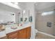 Bathroom with a vanity, large mirror, and a glass-enclosed shower at 14151 W Yosemite Dr, Sun City West, AZ 85375