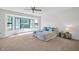 Comfortable bedroom featuring large windows and a ceiling fan at 14151 W Yosemite Dr, Sun City West, AZ 85375