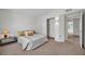 Neutral bedroom with a cozy bed and bedside table with a lamp at 14151 W Yosemite Dr, Sun City West, AZ 85375