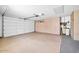 Oversized two-car garage with epoxy floors and ample storage and door to the backyard at 14151 W Yosemite Dr, Sun City West, AZ 85375