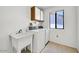 Laundry room with a washer, dryer and sink at 14151 W Yosemite Dr, Sun City West, AZ 85375