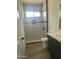 Bright bathroom featuring a tile shower, toilet, and vanity with modern finishes at 1519 N Etta St, Casa Grande, AZ 85122