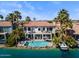 Beautiful home with red tile roof, pool, and waterfront access creates an outdoor oasis at 1539 W Laurel Ave, Gilbert, AZ 85233