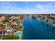 Expansive aerial view of a lake community with palm trees, waterways, and beautiful homes in the background at 1539 W Laurel Ave, Gilbert, AZ 85233