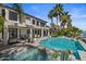 Beautiful outdoor area with pool, hot tub, waterfront access, patio, and desert landscaping at 1539 W Laurel Ave, Gilbert, AZ 85233