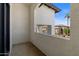 Private balcony offering views of the neighborhood and surrounding landscape with palm trees at 1539 W Laurel Ave, Gilbert, AZ 85233