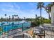 Relaxing balcony with outdoor seating offering views of the community lake and palm trees at 1539 W Laurel Ave, Gilbert, AZ 85233