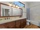 Traditional bathroom with double vanity, granite counters, and a shower/tub combination at 1539 W Laurel Ave, Gilbert, AZ 85233
