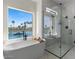 Modern bathroom featuring a standalone tub, separate shower, and picturesque window view at 1539 W Laurel Ave, Gilbert, AZ 85233