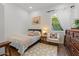 Charming bedroom with hardwood floors, bright window, and unique decor at 1539 W Laurel Ave, Gilbert, AZ 85233