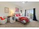Comfortable bedroom with a ceiling fan and access to a private balcony with great views at 1539 W Laurel Ave, Gilbert, AZ 85233