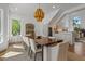Stunning dining room with a modern chandelier, large windows, and bright, open feel at 1539 W Laurel Ave, Gilbert, AZ 85233
