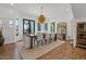 Elegant dining room with a modern chandelier, large windows, and wine storage at 1539 W Laurel Ave, Gilbert, AZ 85233
