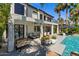 Stunning home exterior with a covered patio, pool, and waterfront views, perfect for outdoor living at 1539 W Laurel Ave, Gilbert, AZ 85233