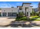Stylish front exterior featuring a large garage and well manicured green lawn and desert landscaping at 1539 W Laurel Ave, Gilbert, AZ 85233