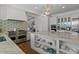 Open kitchen with stainless steel appliances, double oven, and marble countertops, seamlessly connecting to the living area at 1539 W Laurel Ave, Gilbert, AZ 85233