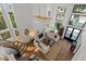 Open-concept living room with a stunning chandelier and abundant natural light at 1539 W Laurel Ave, Gilbert, AZ 85233