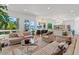 Living room with tan seating, carpet and view of trees and water at 1539 W Laurel Ave, Gilbert, AZ 85233