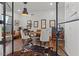 Stylish home office with a modern desk, comfortable chairs, and glass door access at 1539 W Laurel Ave, Gilbert, AZ 85233