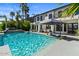 Stunning pool with sunshade, outdoor seating, and tropical landscaping creates a backyard oasis at 1539 W Laurel Ave, Gilbert, AZ 85233