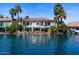 Exterior shot showcasing a waterfront property with stunning views of the serene lake at 1539 W Laurel Ave, Gilbert, AZ 85233