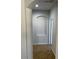 Hallway features beige walls and tile floors with a decorative niche in the wall at 15461 W Jefferson St, Goodyear, AZ 85338