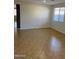 Open and bright living room with tile flooring and lots of natural light at 15461 W Jefferson St, Goodyear, AZ 85338