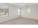 Bright bedroom has large windows and neutral carpet adding charm and comfort at 1550 S Chaparral Blvd, Gilbert, AZ 85296