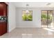 Dining area featuring beautiful tiling, recessed lighting, a glass chandelier, and a view to the backyard at 1550 S Chaparral Blvd, Gilbert, AZ 85296