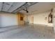 Spacious two car garage with epoxy floors and built in cabinetry and a water heater at 1550 S Chaparral Blvd, Gilbert, AZ 85296
